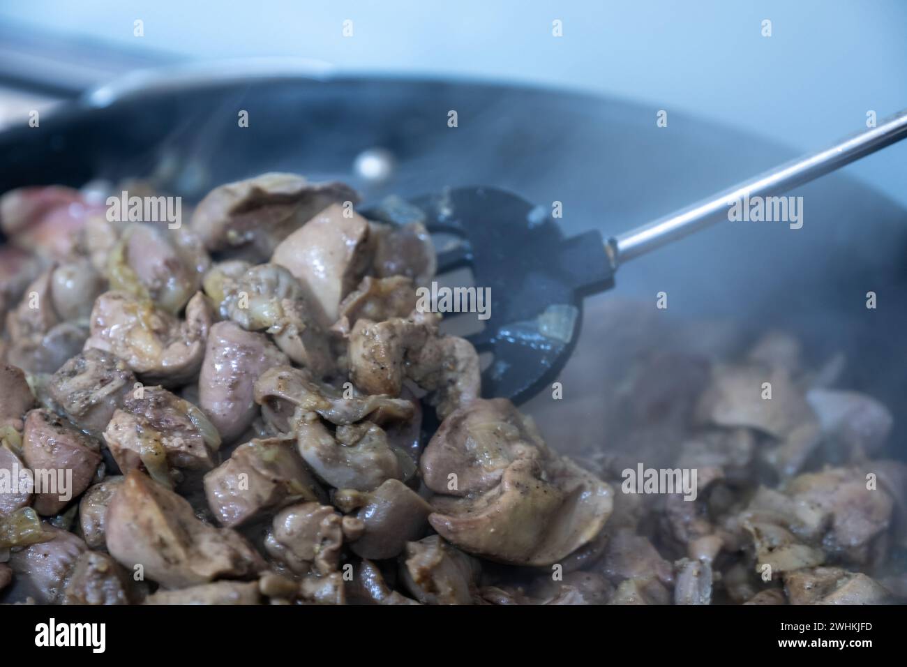 pan full of chicken livers and gizzards Stock Photo Alamy