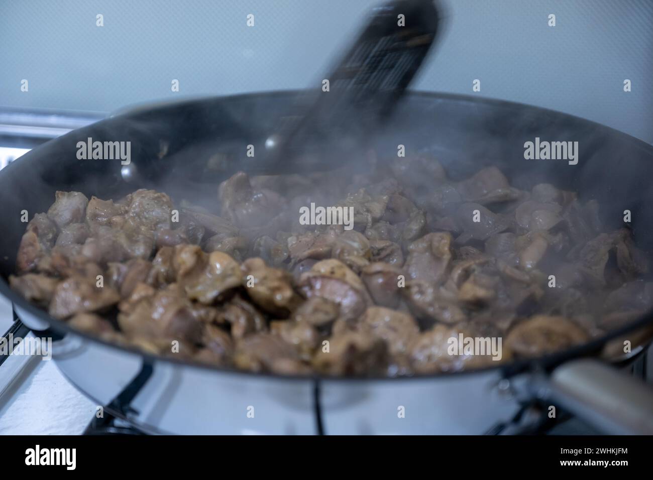 pan full of chicken livers and gizzards Stock Photo Alamy