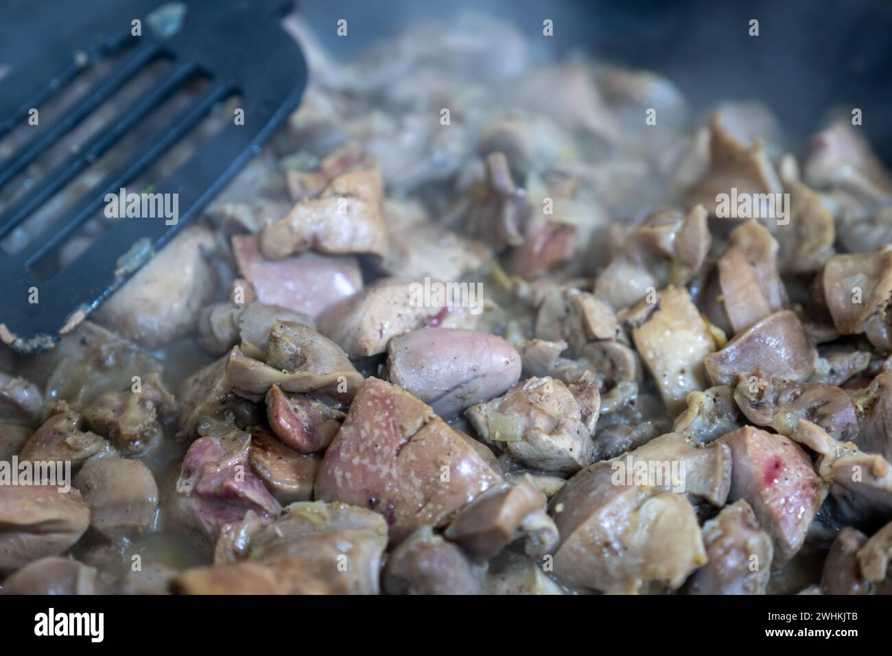 pan full of chicken livers and gizzards Stock Photo Alamy
