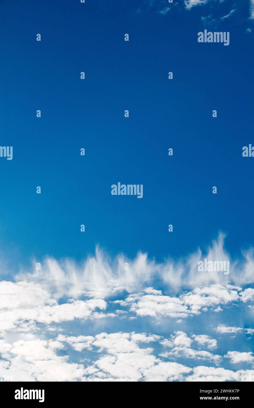 White color clouds cover the blue sky in the daytime Stock Photo