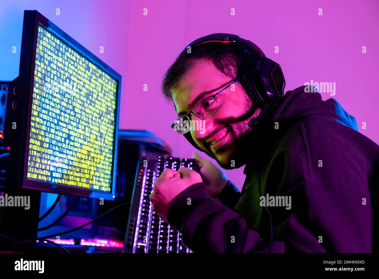 arabic guy working on some code trying to solve the problem Stock Photo