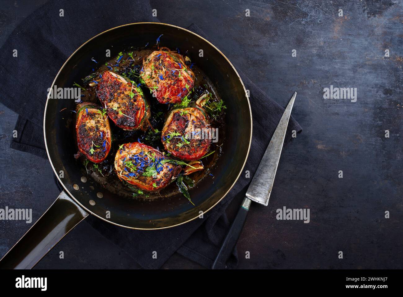 Traditional roasted veal filet medallions with bacon coating and sage