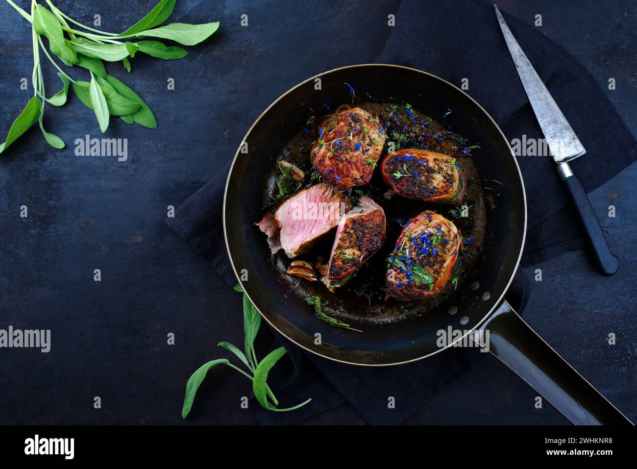 Traditional roasted veal filet medallions with bacon coating and sage