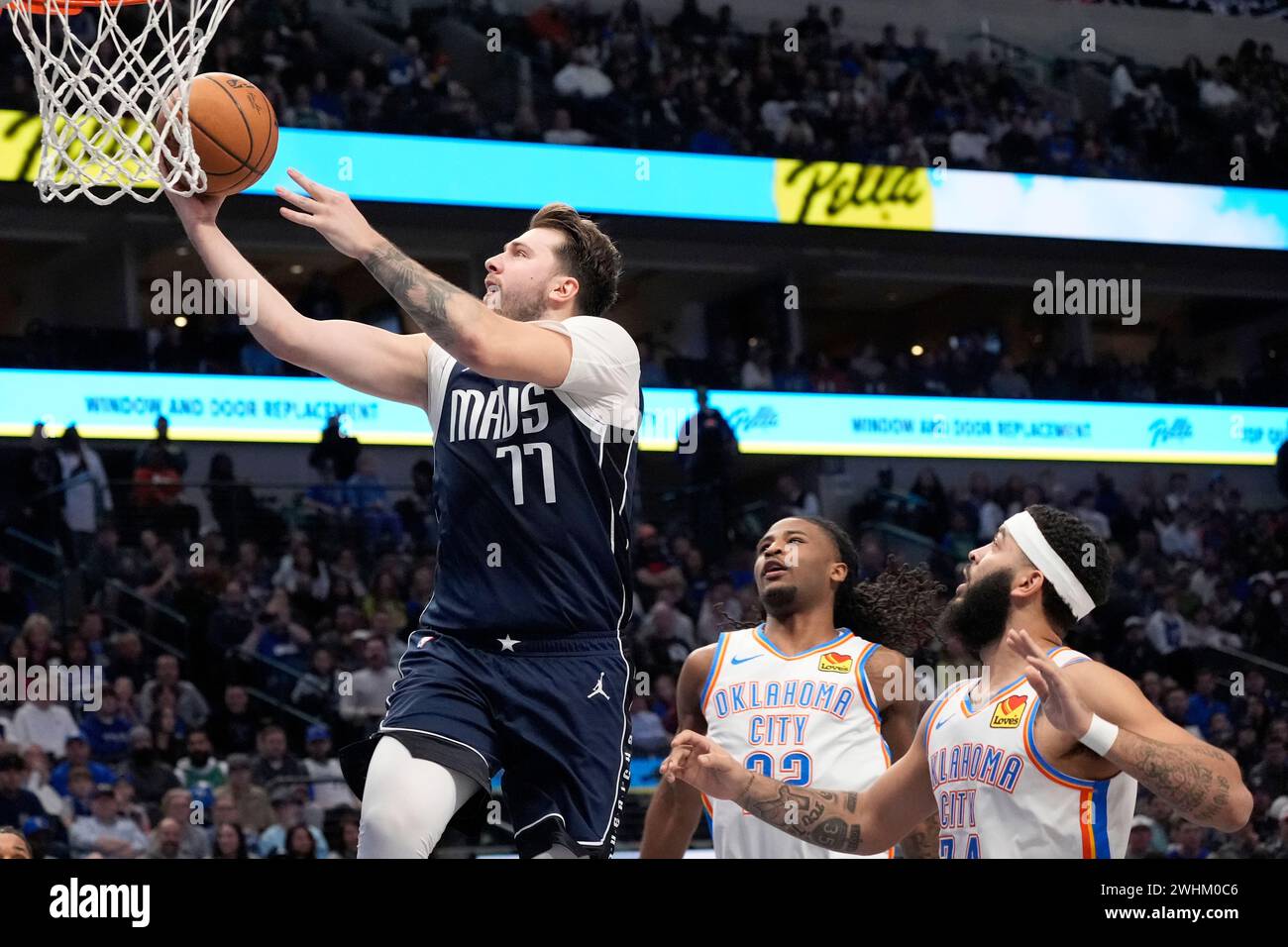 Dallas Mavericks guard Luka Doncic (77) leaps to the basket to take a ...