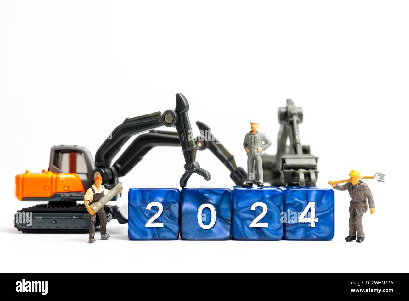 Miniature people , Worker team flips a block with the number 2024 Stock Photo