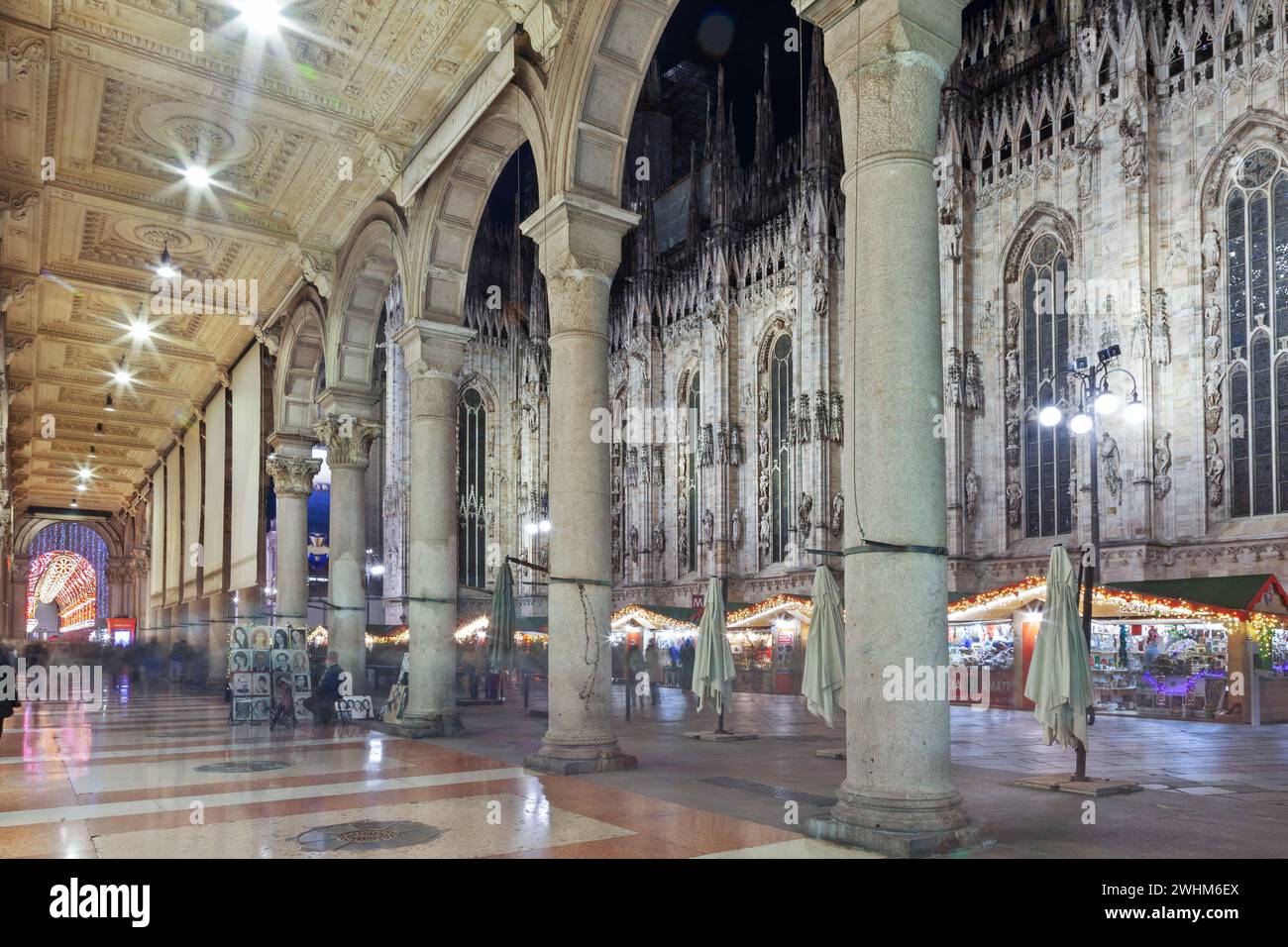 Night view of the Duomo di Milano through the arches of the Vittorio Emanuele II gallery during Christmas time. Stock Photo