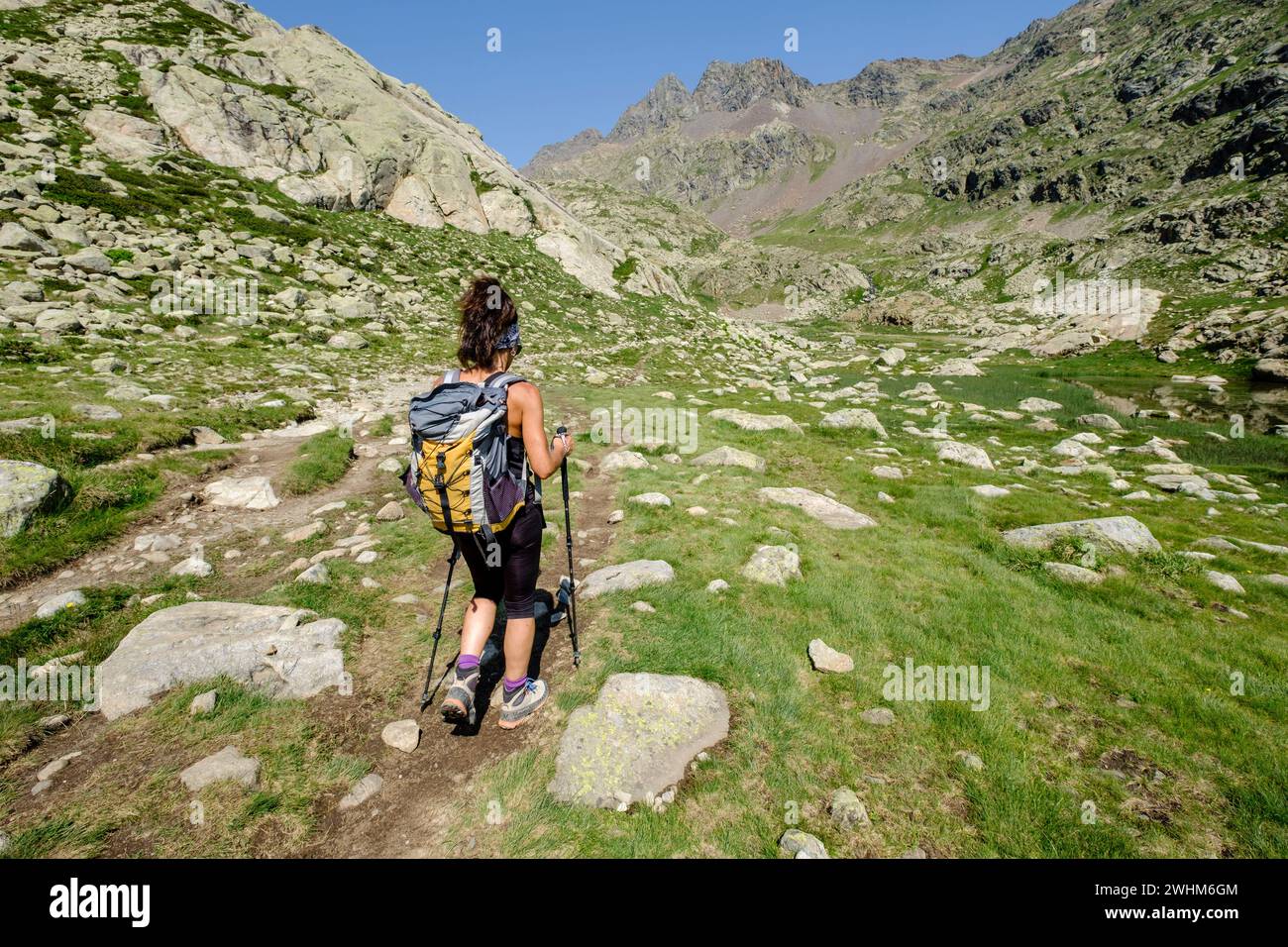 Hiker on Ibones azules and BachimaÃ±a alto route Stock Photo
