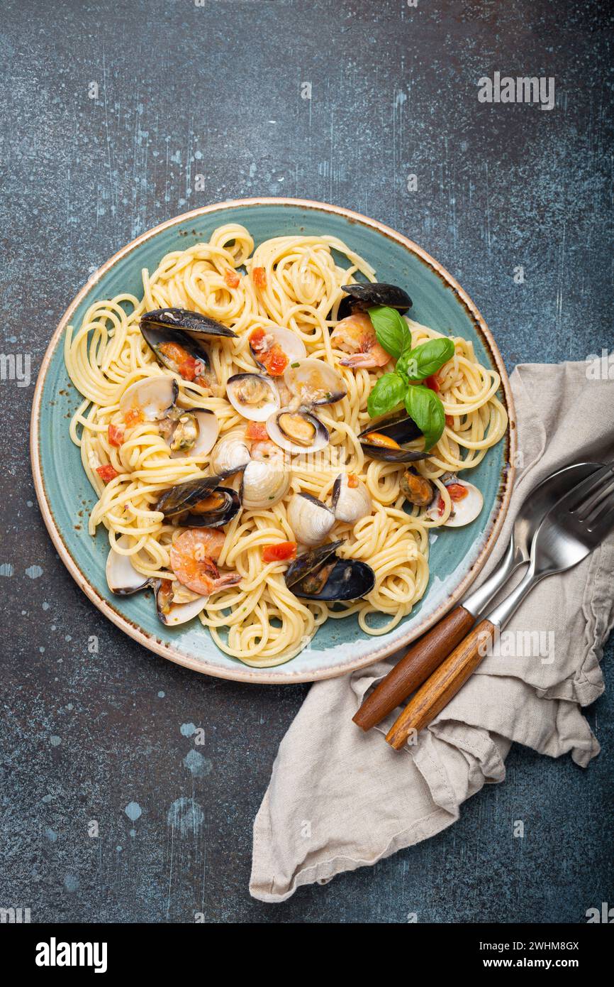 Italian seafood pasta spaghetti with mussels, shrimps, clams in tomato
