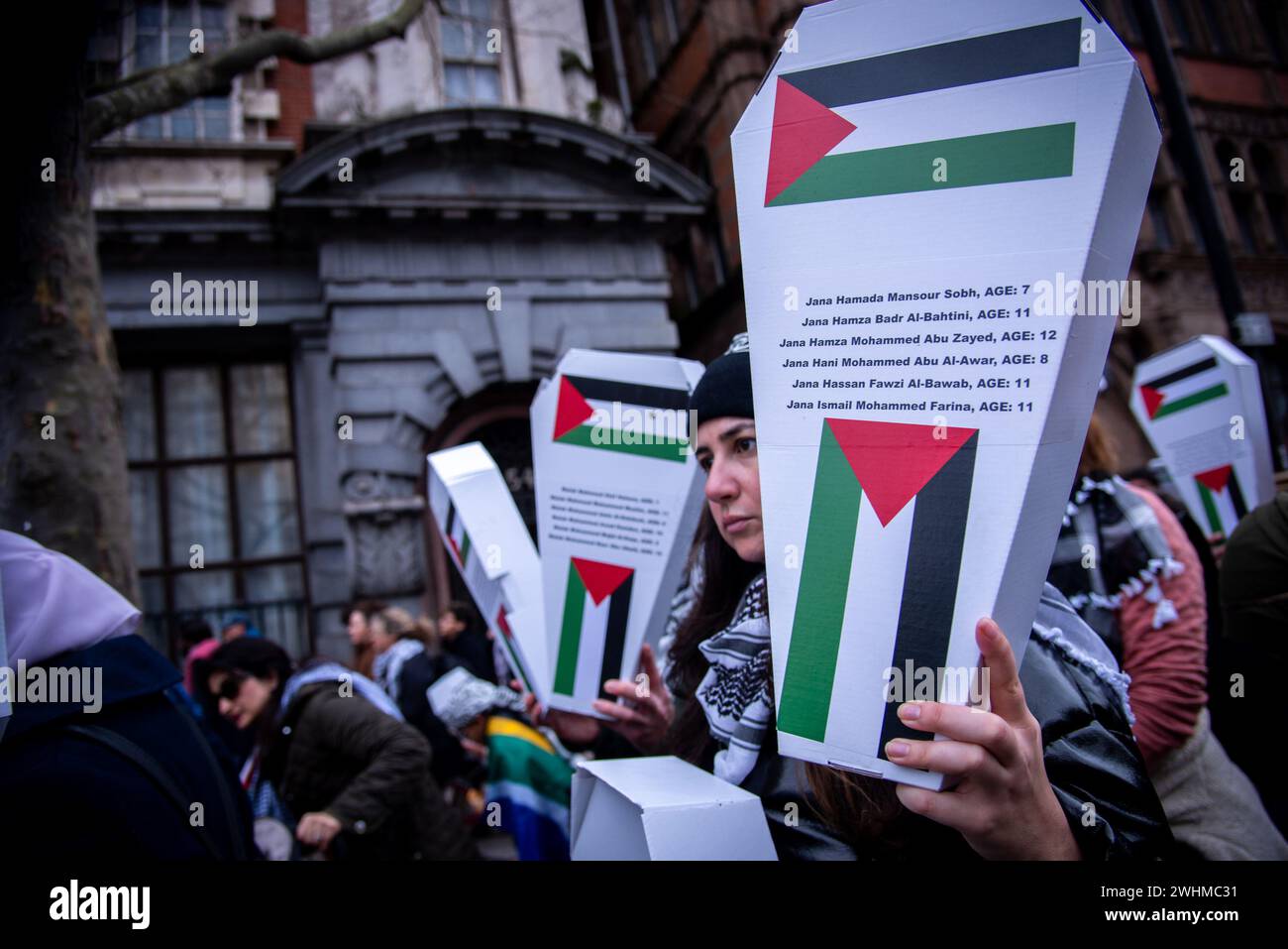 London, UK. 10th Feb, 2024. Protestors hold coffin-shaped boxes during the Day of Action for Palestine: Ceasefire Now! Protest. Protestors demand the British government to call for an immediate and permanent ceasefire and the lifting of the siege on Gaza, and ends its complicity in Israel's genocidal assault on Palestinians, including by adopting an immediate two-way arms embargo. (Photo by Loredana Sangiuliano/SOPA Images/Sipa USA) Credit: Sipa USA/Alamy Live News Stock Photo