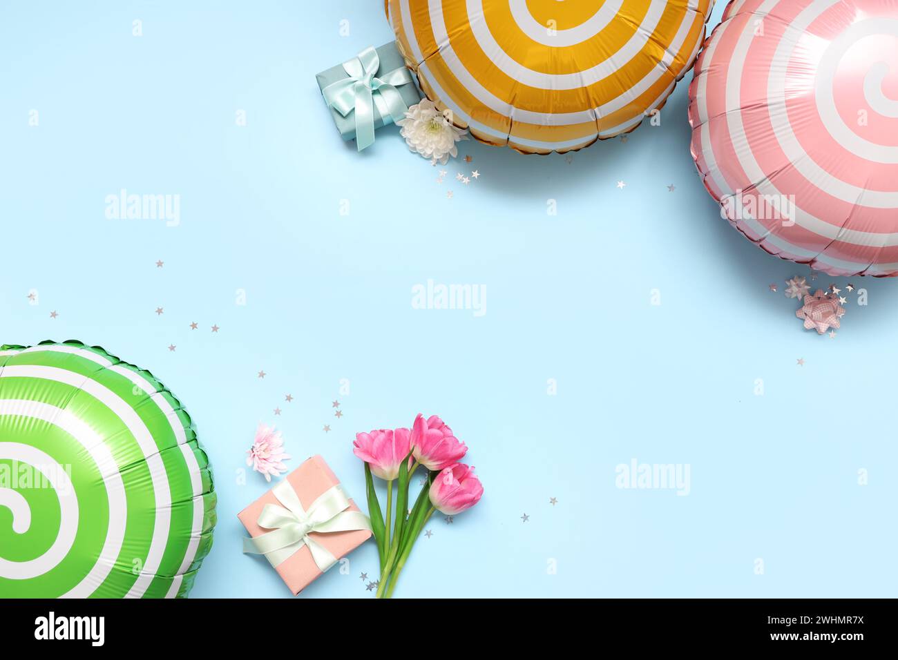Different balloons with gift boxes and flowers on blue background Stock  Photo - Alamy, image size:1300x956