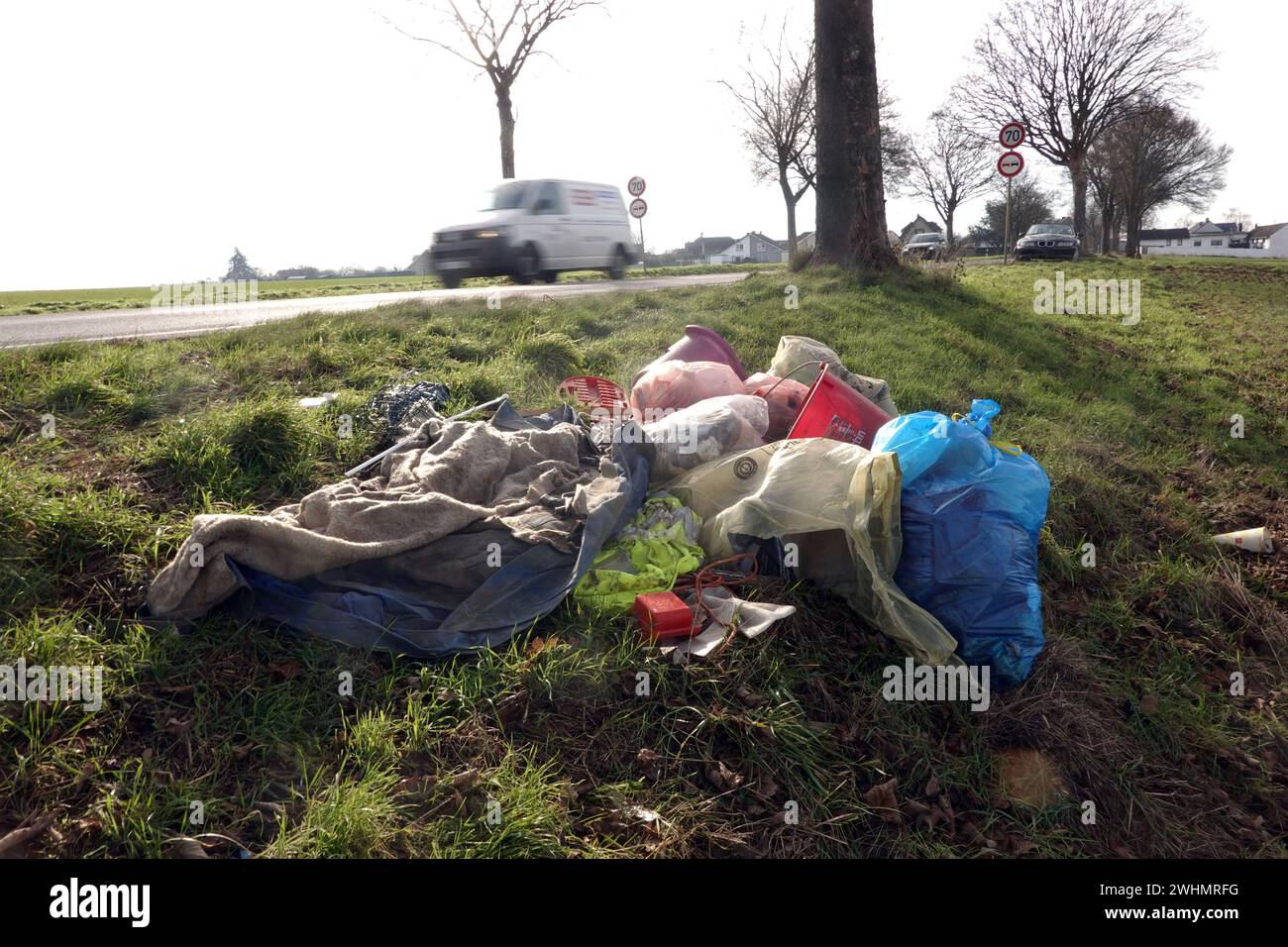 Illegal garbage disposal at the roadside Stock Photo - Alamy