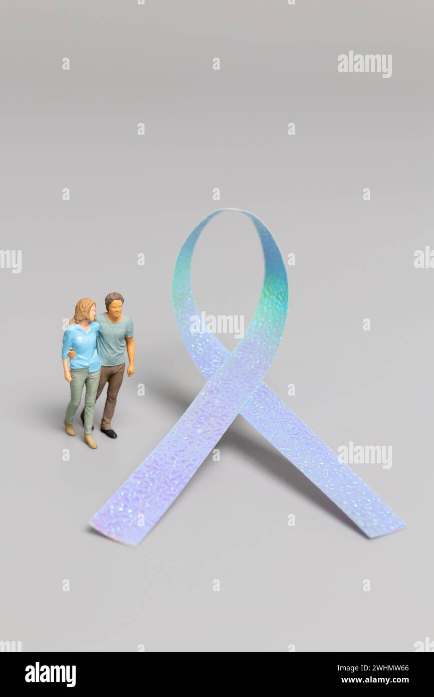 Couple standing in front a ribbons , World cancer day concept Stock Photo