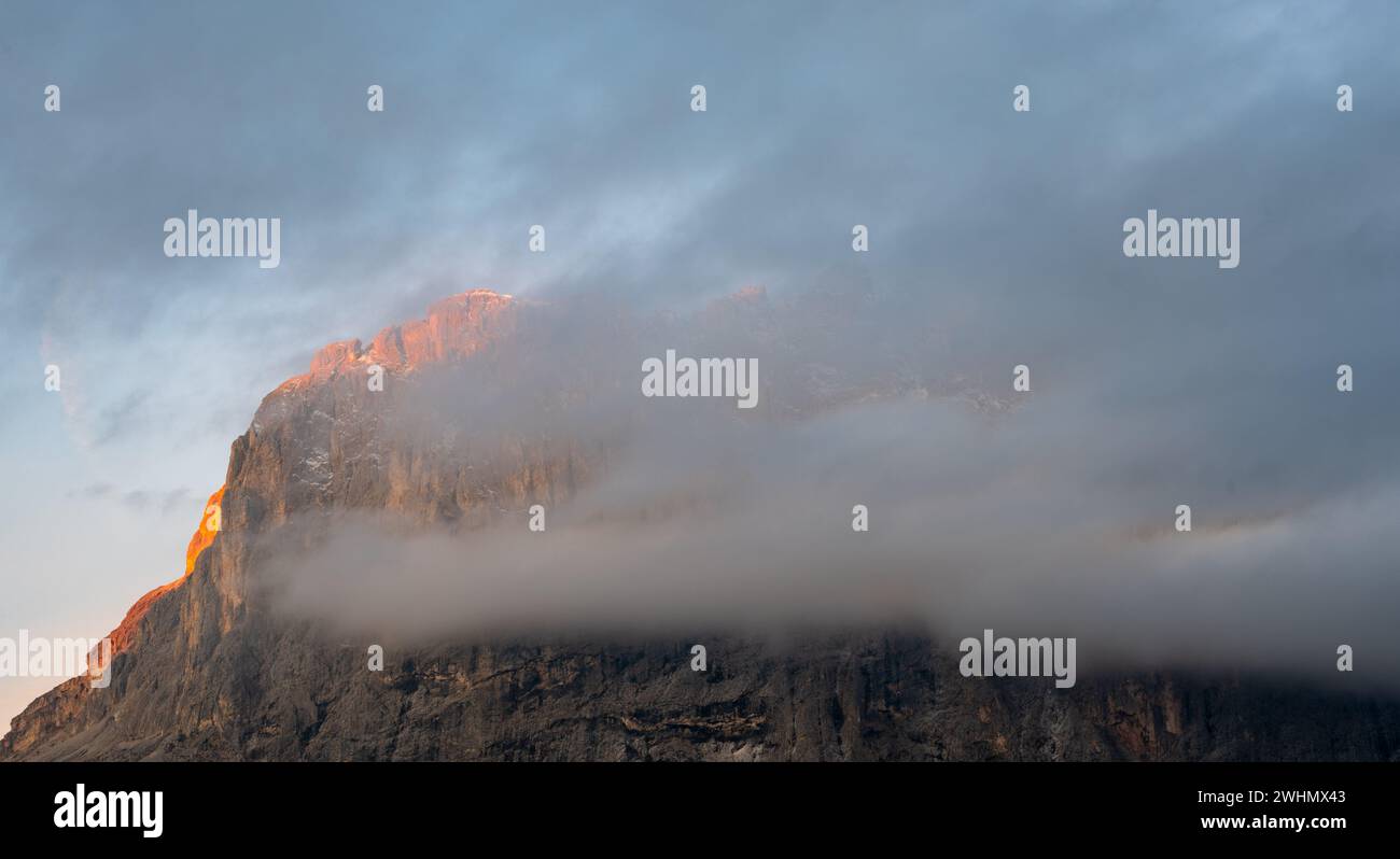 Foggy rocky mountain landscape at sunrise with blue sky Stock Photo - Alamy