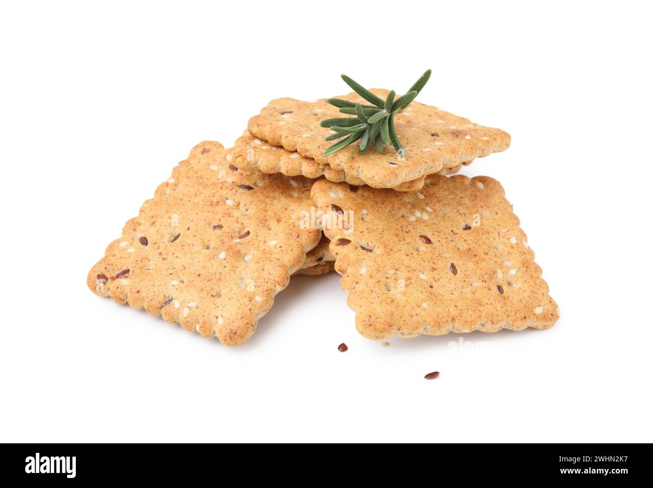Stack of cereal crackers with flax, sesame seeds and rosemary isolated ...