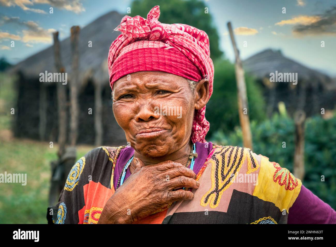 old African standing  in front of the house  in an African village Stock Photo