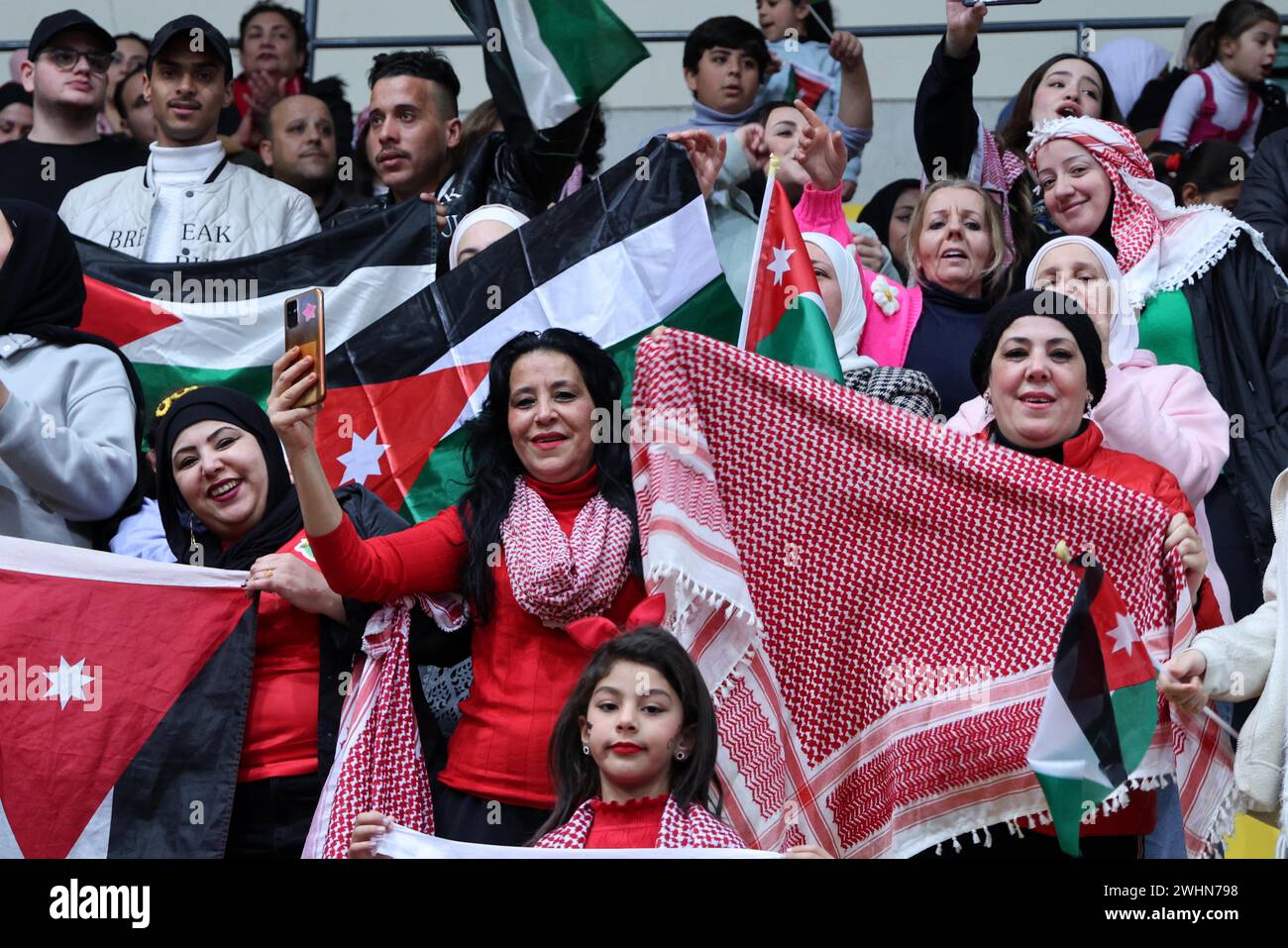 Amman, Jordan. 10th Feb, 2024. Jordanians cheer while watching the AFC ...