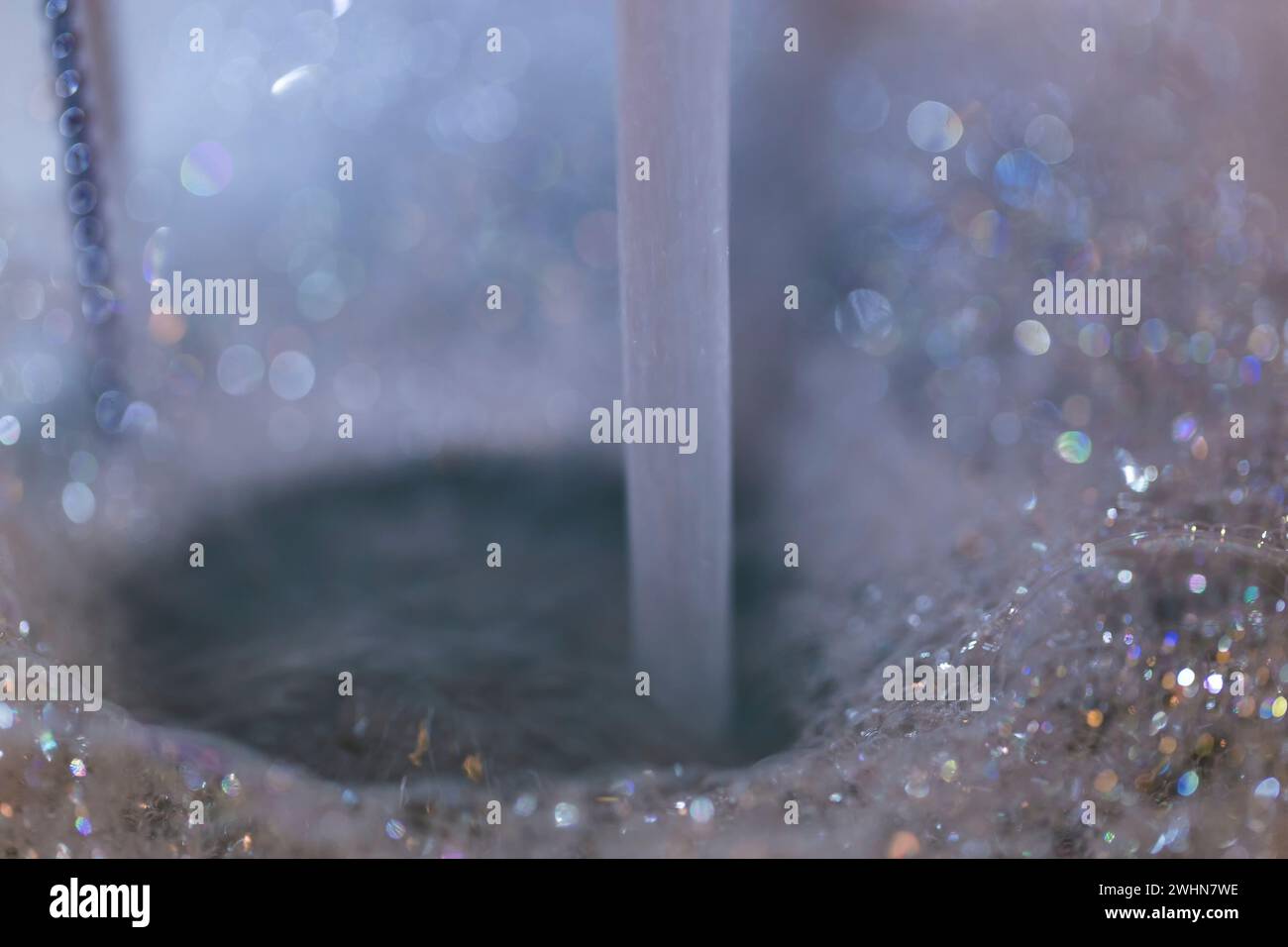 Water Spout and bubbles background.Bath running Stock Photo