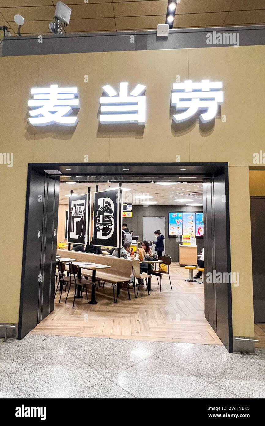 Customers enter a McDonald's in ??Kunming Changshui International Airport?, ?Yunnan?, ?China? on Dec. 8, 2023. There are more than 4,000 McDonald's in China. (Photo by Samuel Rigelhaupt/Sipa USA) Credit: Sipa USA/Alamy Live News Stock Photo