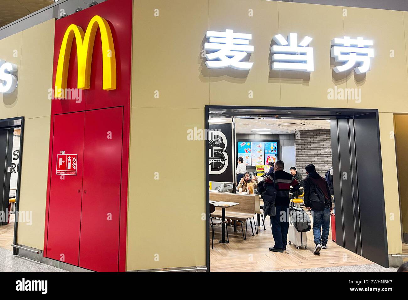 Customers enter a McDonald's in ??Kunming Changshui International Airport?, ?Yunnan?, ?China? on Dec. 8, 2023. There are more than 4,000 McDonald's in China. (Photo by Samuel Rigelhaupt/Sipa USA) Credit: Sipa USA/Alamy Live News Stock Photo