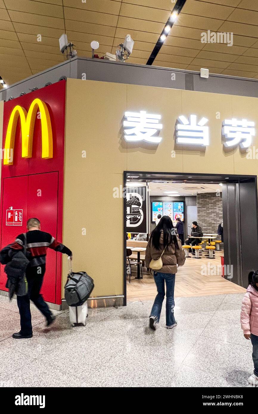 Customers enter a McDonald's in ??Kunming Changshui International Airport?, ?Yunnan?, ?China? on Dec. 8, 2023. There are more than 4,000 McDonald's in China. (Photo by Samuel Rigelhaupt/Sipa USA) Credit: Sipa USA/Alamy Live News Stock Photo