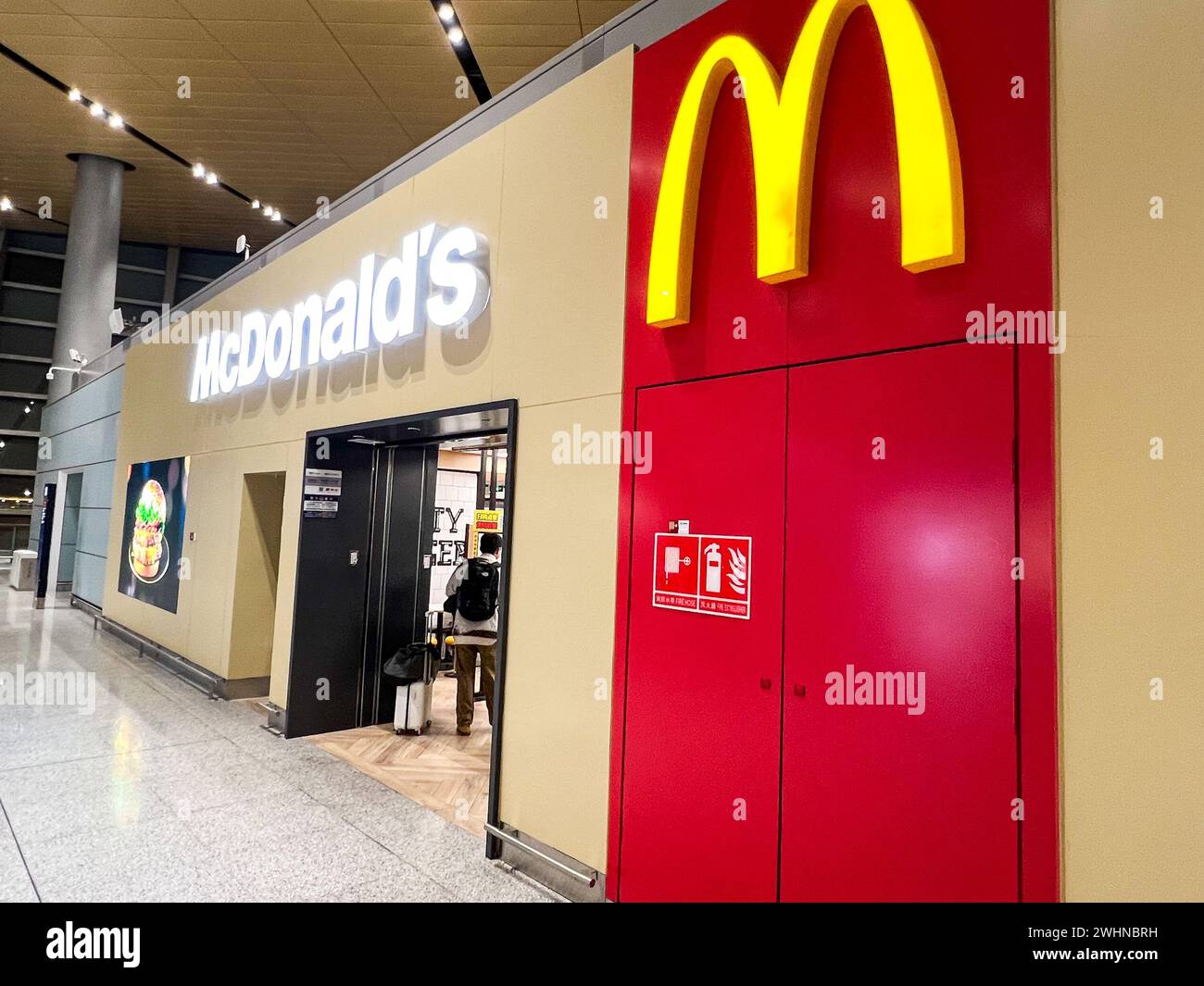 Customers enter a McDonald's in ??Kunming Changshui International Airport?, ?Yunnan?, ?China? on Dec. 8, 2023. There are more than 4,000 McDonald's in China. (Photo by Samuel Rigelhaupt/Sipa USA) Credit: Sipa USA/Alamy Live News Stock Photo