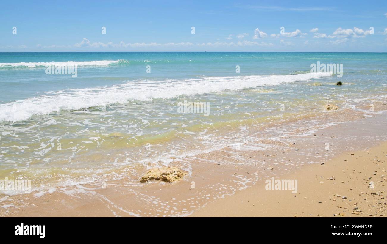 Wave crashing on sandy beach hi-res stock photography and images - Alamy