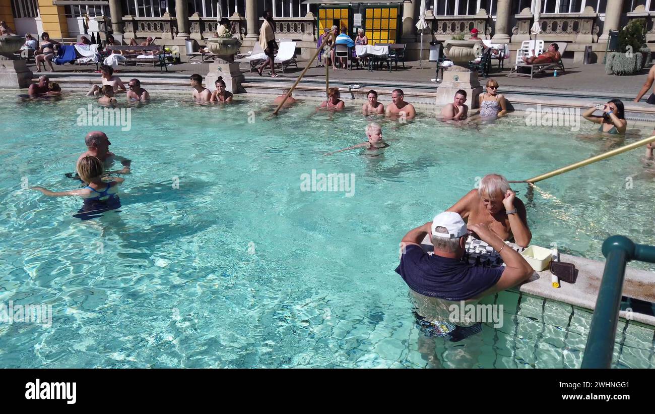 BUDAPEST, HUNGARY October 2019. Men playing chess at Szechenyi Baths, thermal bath complex Stock Photo