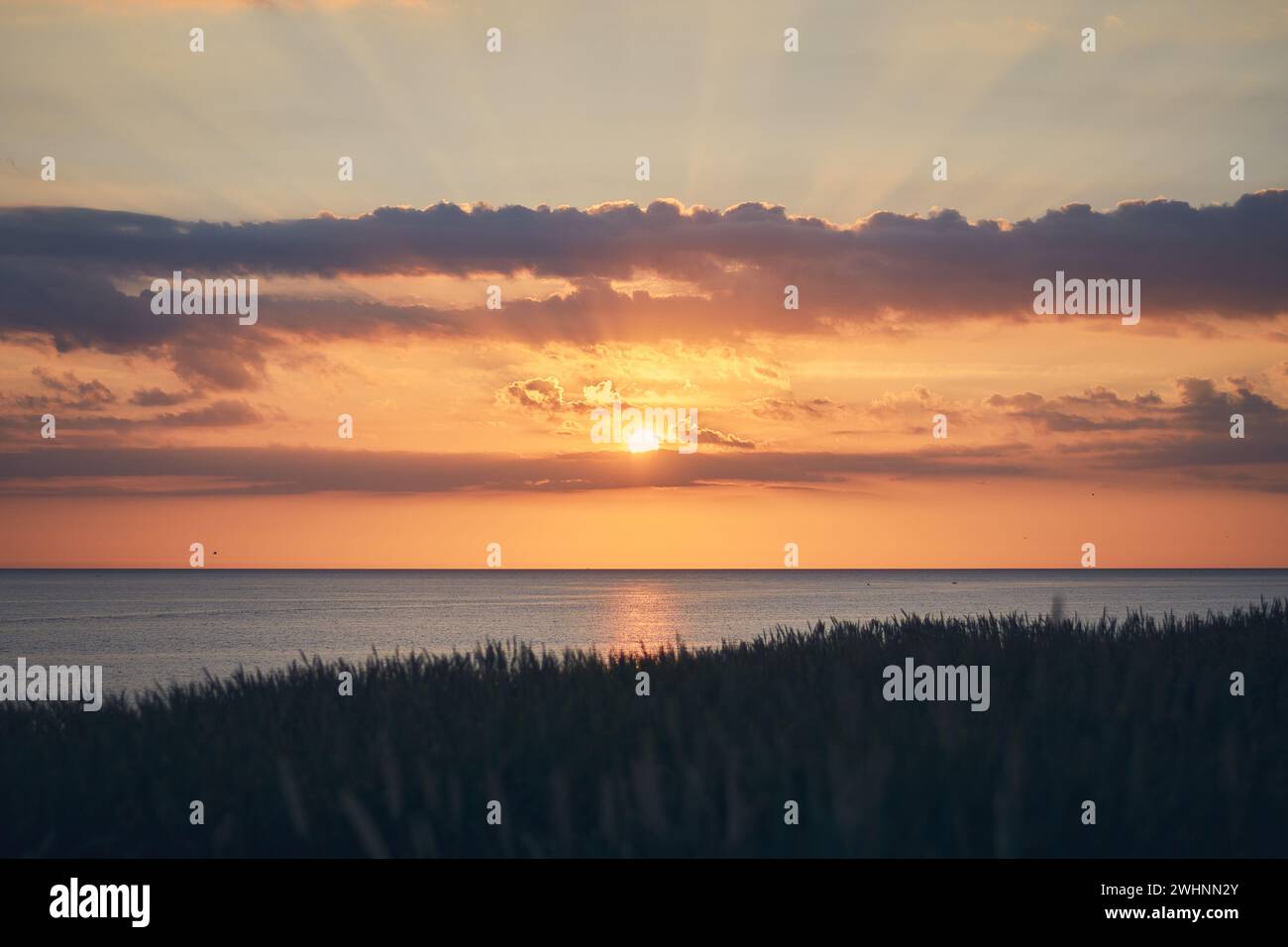 Sun setting at the north sea in Denmark Stock Photo