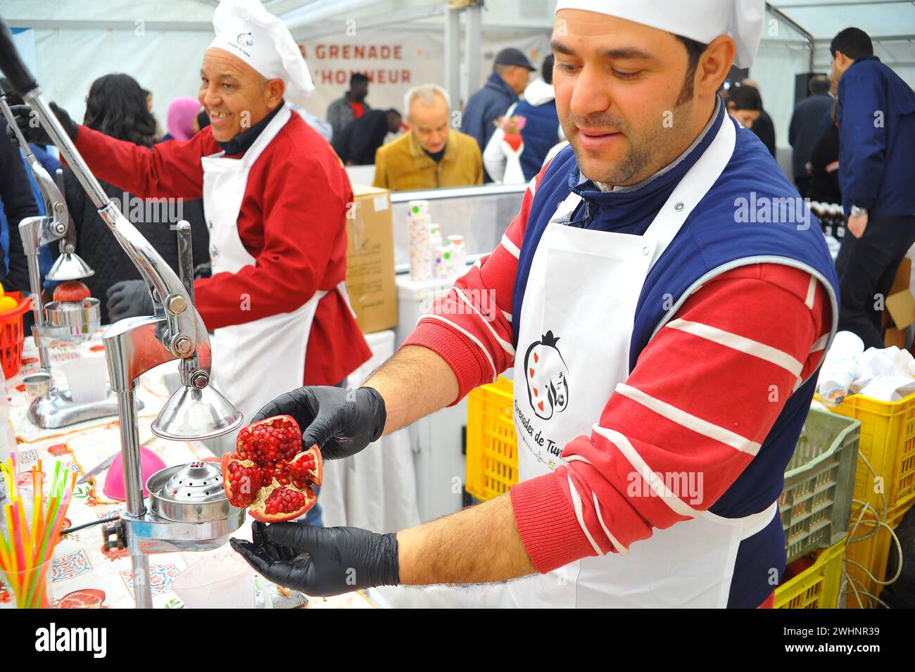 Tunis. 10th Feb, 2024. Workers prepare pomegranate juice at a food exhibition in Tunis, Tunisia on Feb. 10, 2024. Credit: Adel Ezzine/Xinhua/Alamy Live News Stock Photo