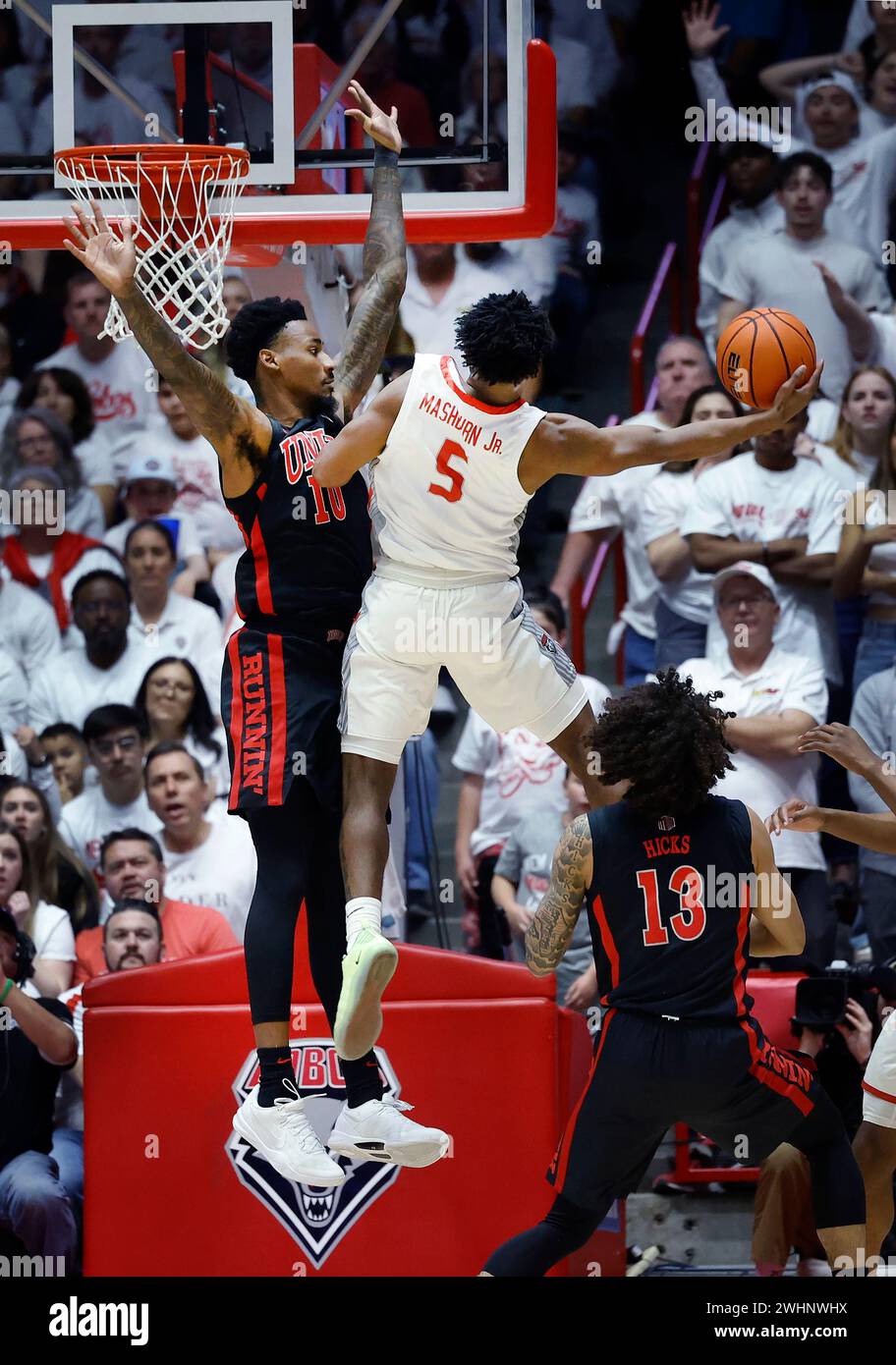 New Mexico guard Jamal Mashburn Jr. goes to the basket as UNLV forward