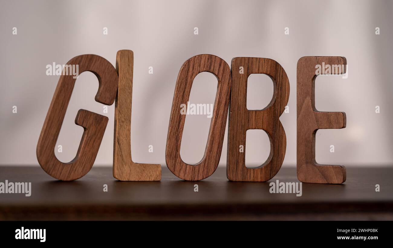 Natural Typography: Wooden 3D Letters Spell 'Global' on Table Stock Photo