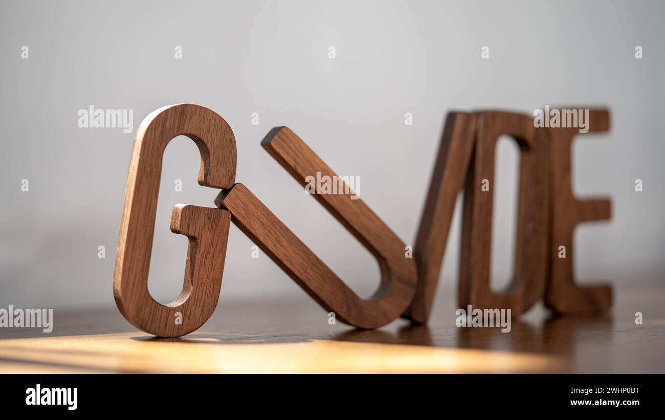 Creative Compass: Wooden 3D 'GUIDE' Letters Inspire Perfection Stock Photo