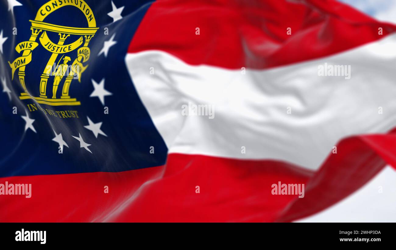 Close-up of Georgia state flag waving in the wind on a clear day Stock Photo