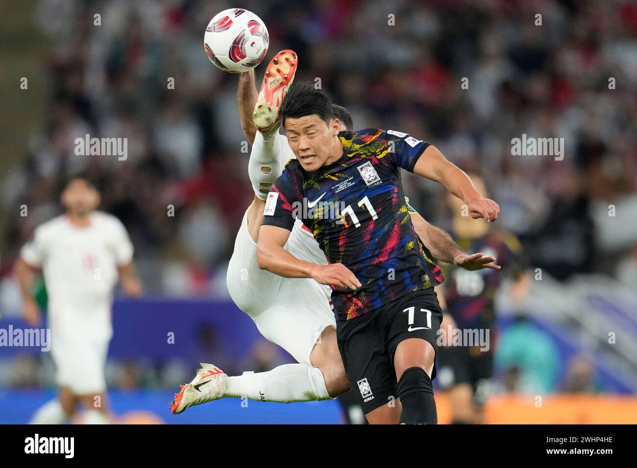 Hwang Rahi South Korea's Hwang Hee-chan, centre, and Jordan's Ehsan Haddad, rear ...