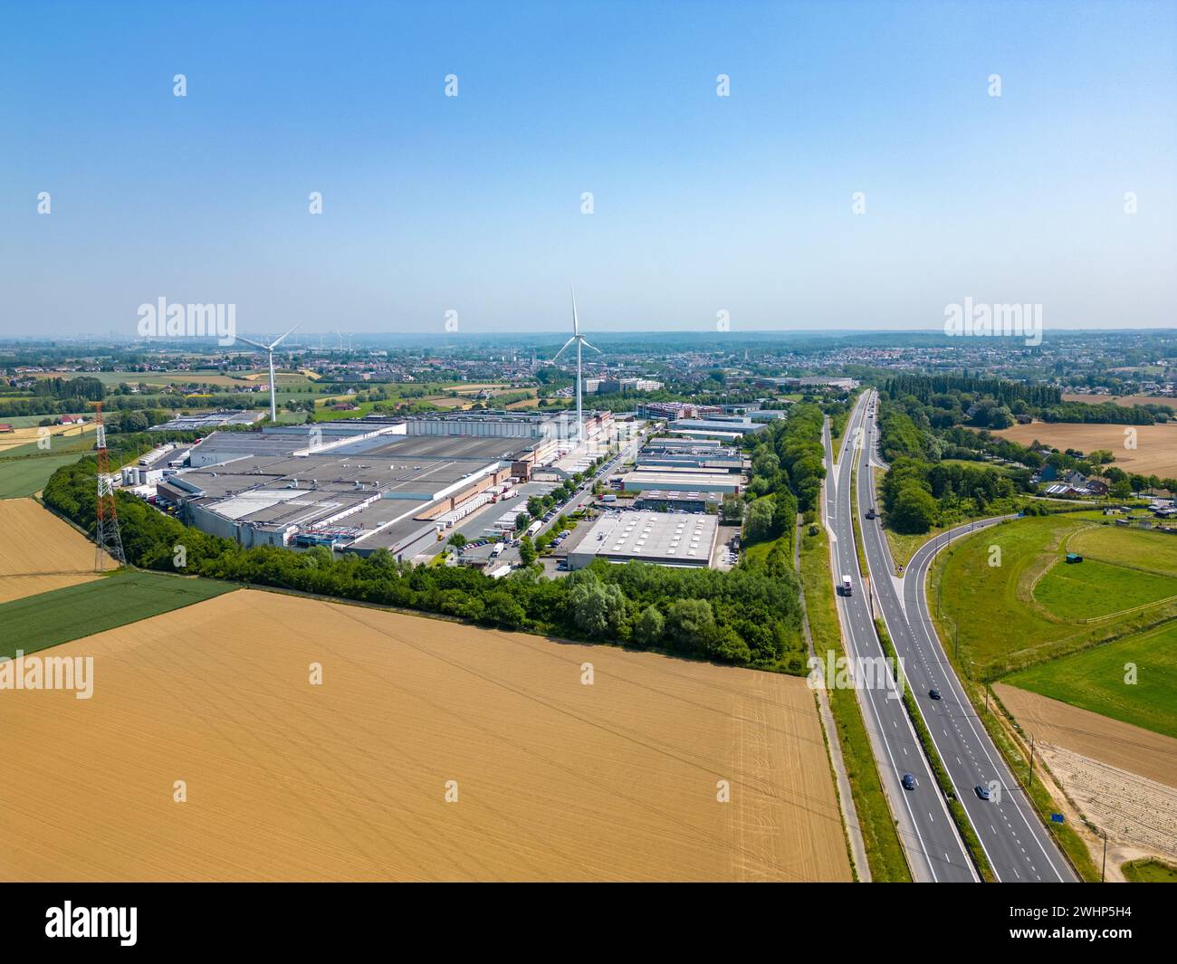 Halle, Vlaams Brabant, Belgium, 6th of July, 2023, Panoramic aerial drone view of the E19 motorway from Brussels to Charleroi wi Stock Photo