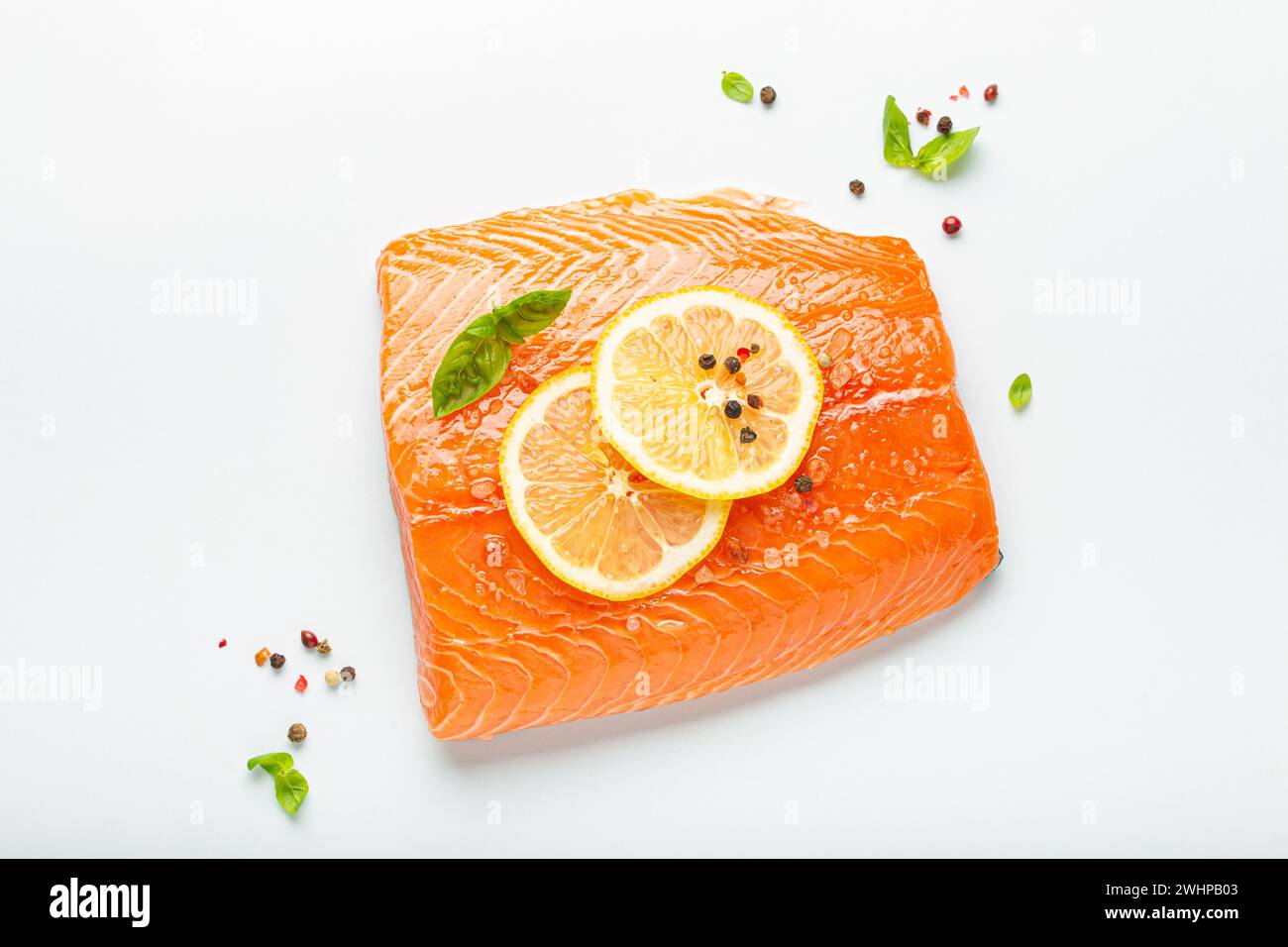 Fresh raw salmon marbled fillet isolated on white background with lemon ...