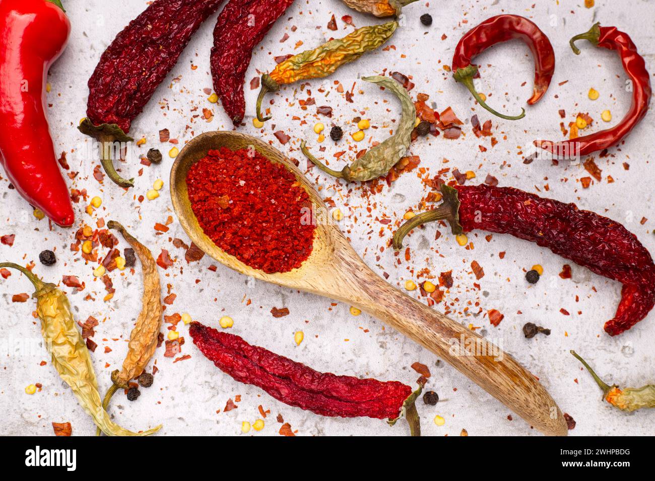 Close up flat lay of peppers and powder. Stock Photo