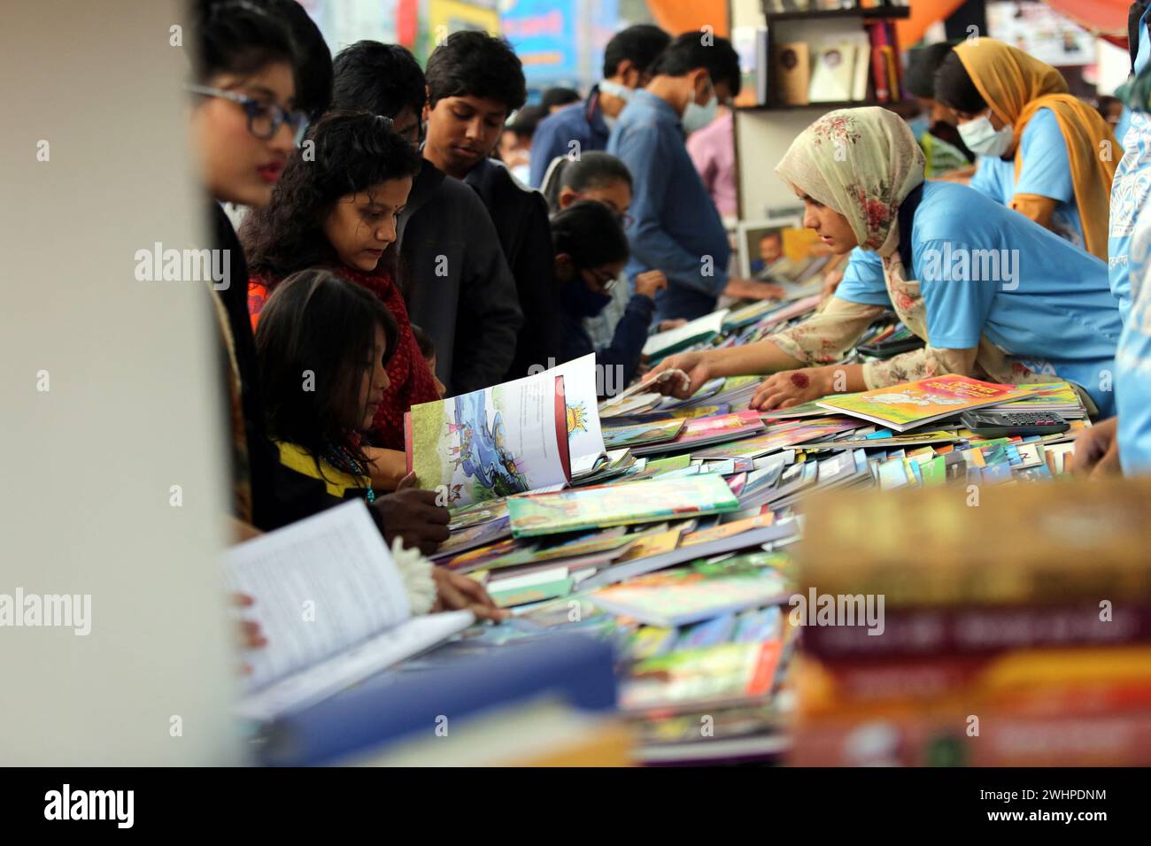 Dhaka, Bangladesh. 11th Feb, 2024. Visitors read books at the national
