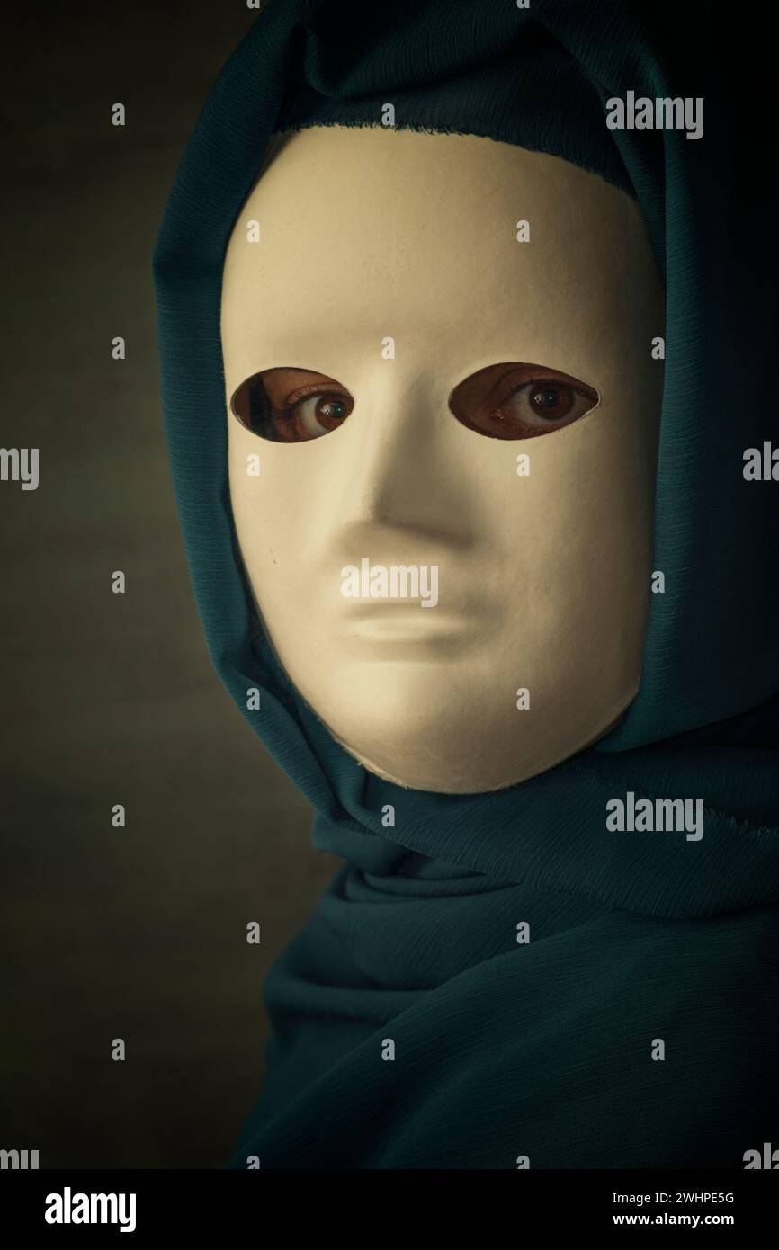 Mysterious female wearing a white mask Stock Photo Alamy