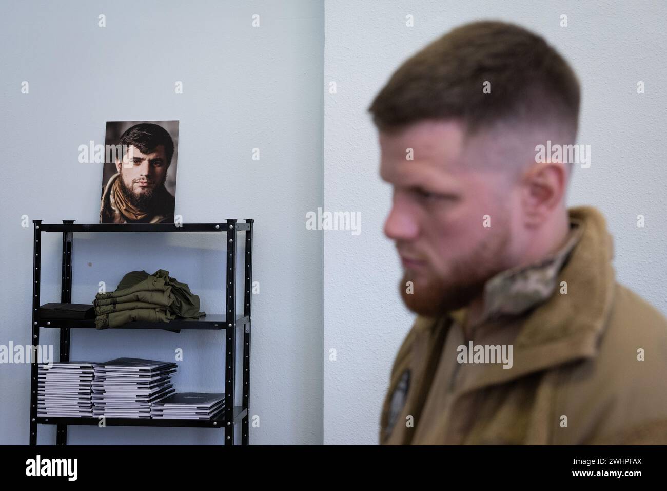 Serhiy Filimonov, commander of a battalion 'Da Vinci's wolves' of the Ukrainian Armed Forces, named of nom-de-guerre of their commander Dmytro Kotsiubailo, Hero of Ukraine, who was killed in a fight against Russian troops near the frontline city of Bakhmut in March 2023, stands in front of a portrait of Dmytro Kotsiubailo in a newly opened recruiting center in Kyiv. A Separate Mechanized Battalion 'Da Vinci Wolves' announced the opening of recruiting centers in several cities across the country. (Photo by Oleksii Chumachenko/SOPA Images/Sipa USA) Stock Photo