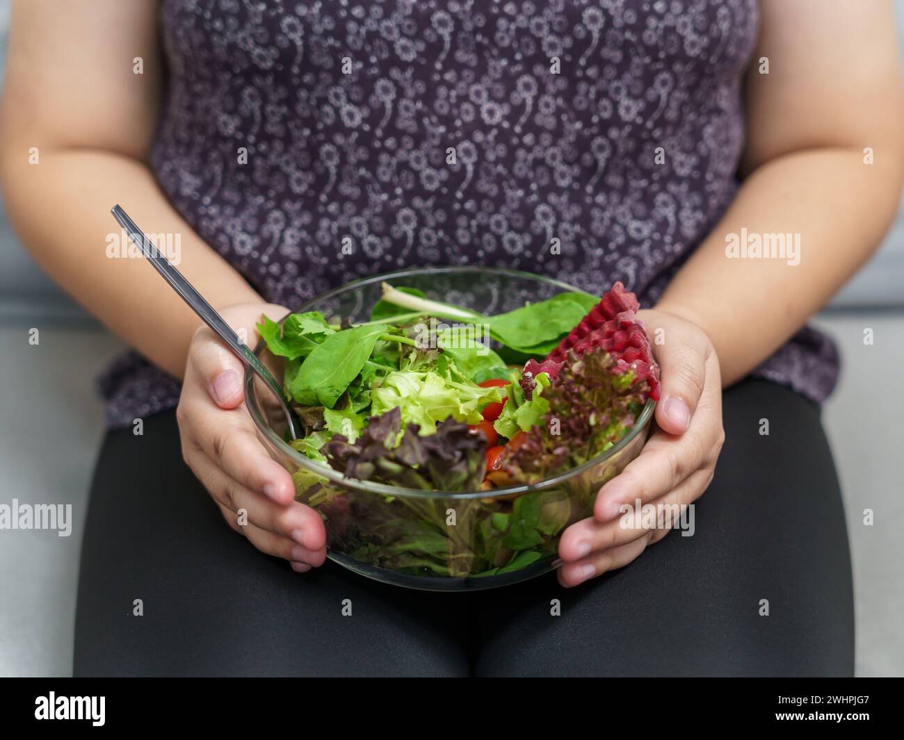 Asian Overweight woman dieting Weight loss eating fresh fresh homemade salad healthy eating concept Obese Woman with weight diet Stock Photo