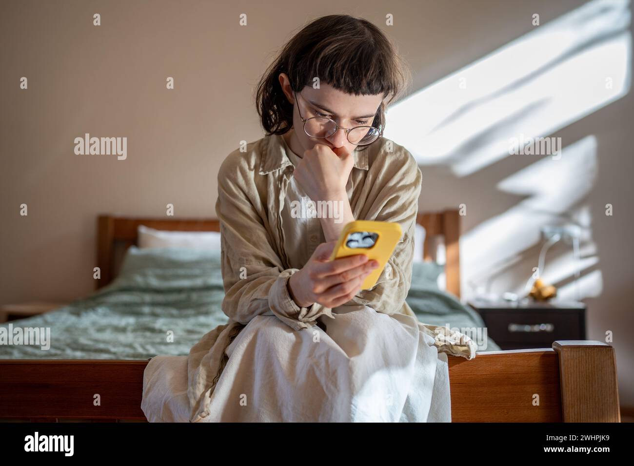 Outcast teenage girl having social difficulties in communication spending time at home in solitude Stock Photo
