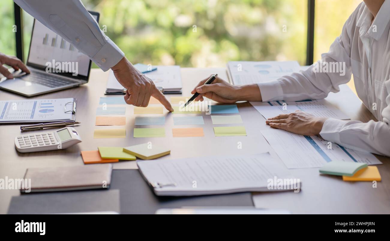 Business People brainstorming Meeting Design Ideas use post it notes to ...