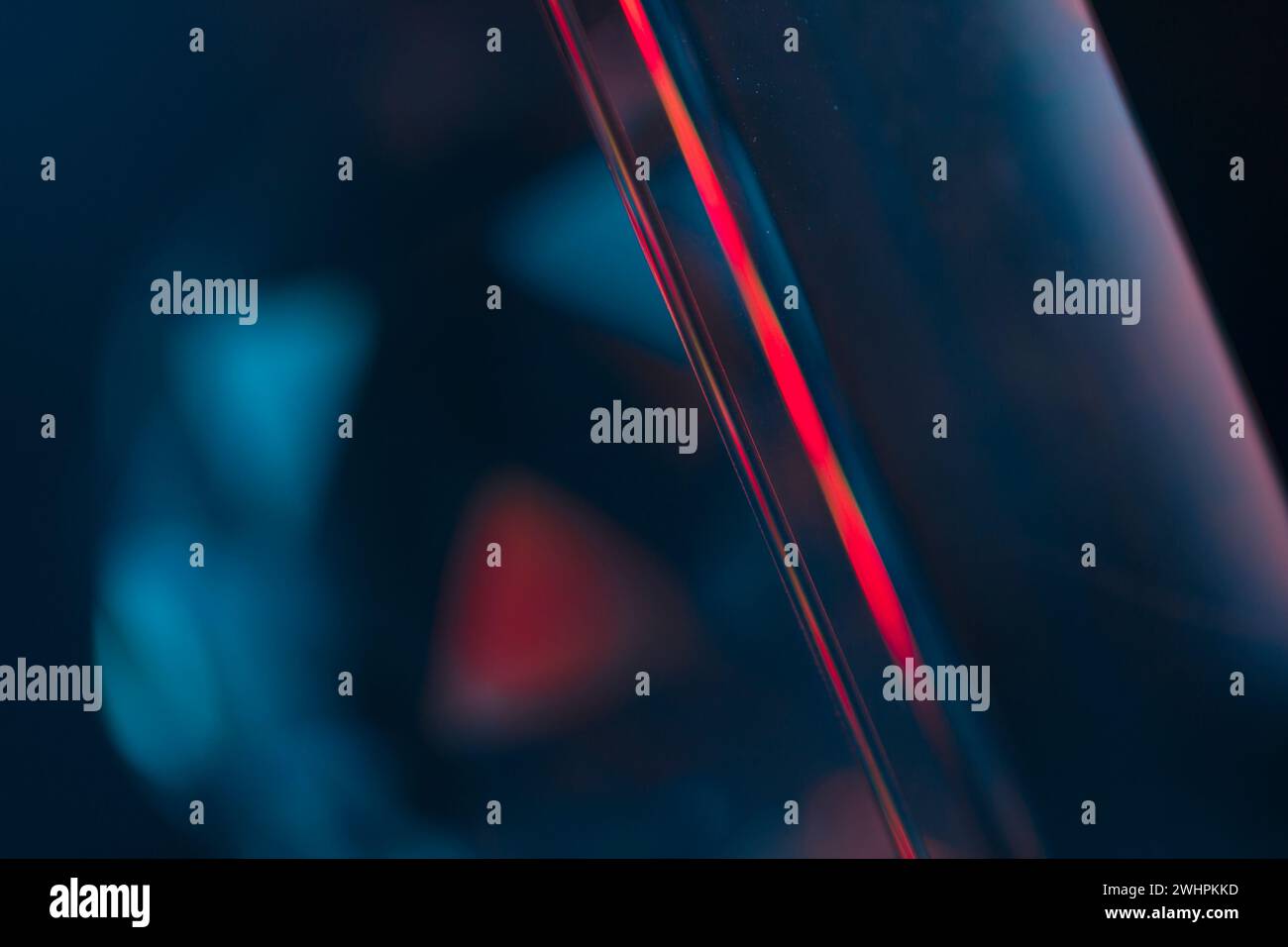 Overlay of a light leak coloured in red and cyan hues. Background is