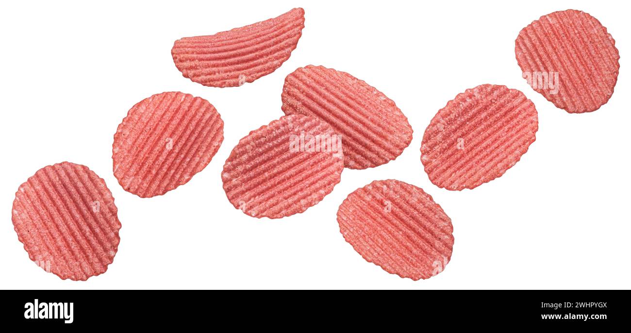 Falling red ridged beetroot chips isolated on white background Stock Photo