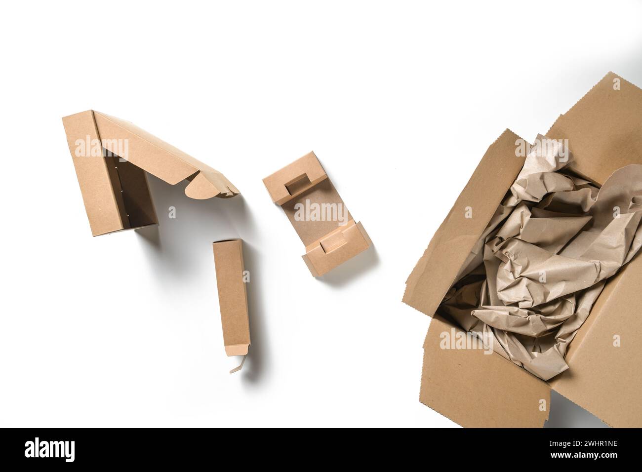 Various packaging made of cardboard boxes and paper, sustainable and plastic-free on a white background, high angel view from ab Stock Photo