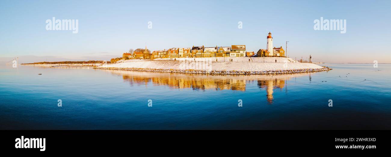 Lighthhouse of Urk Netherlands during sunset in the Netherlands Stock Photo
