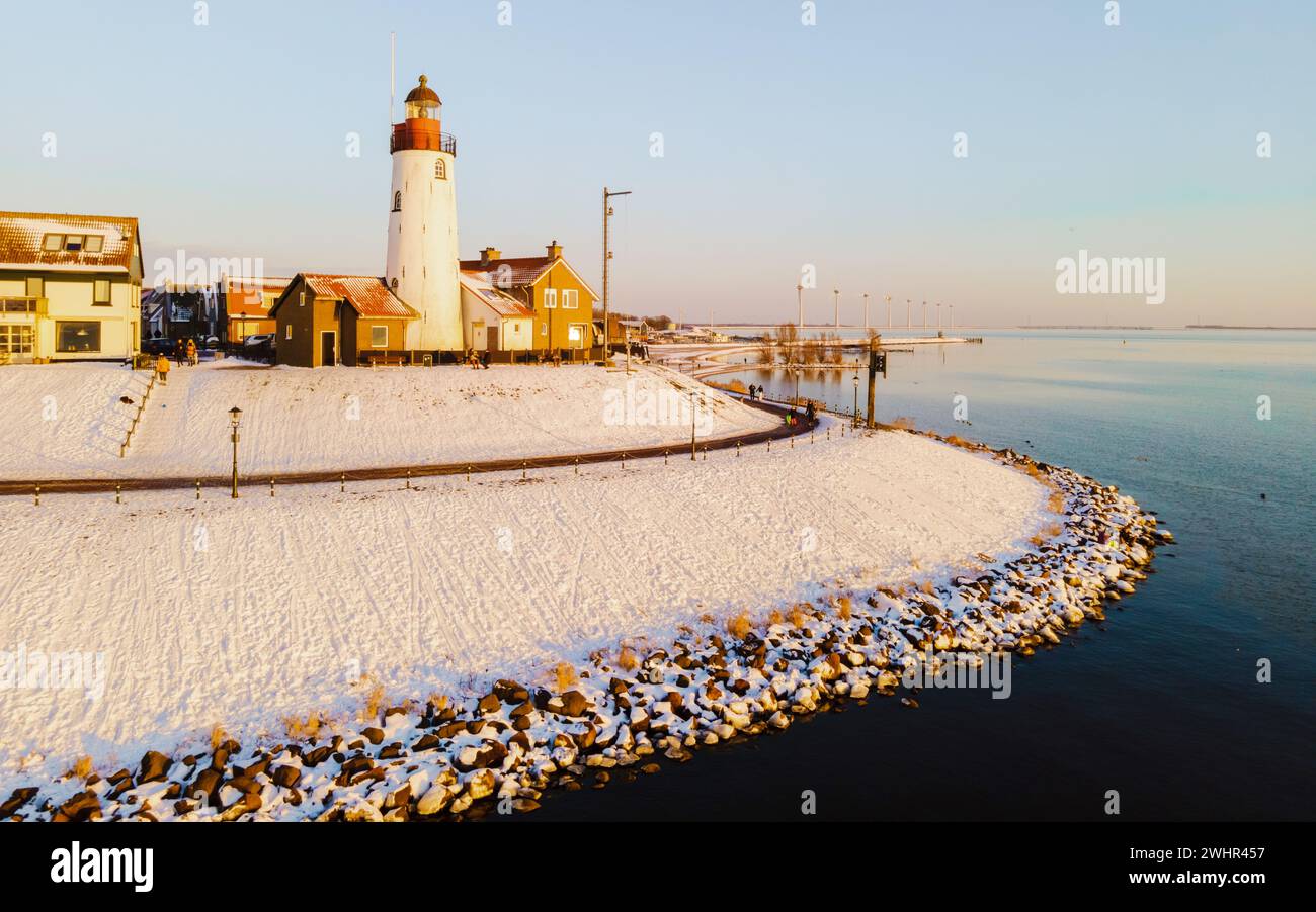 Lighthhouse of Urk Netherlands during sunset in the Netherlands Stock Photo