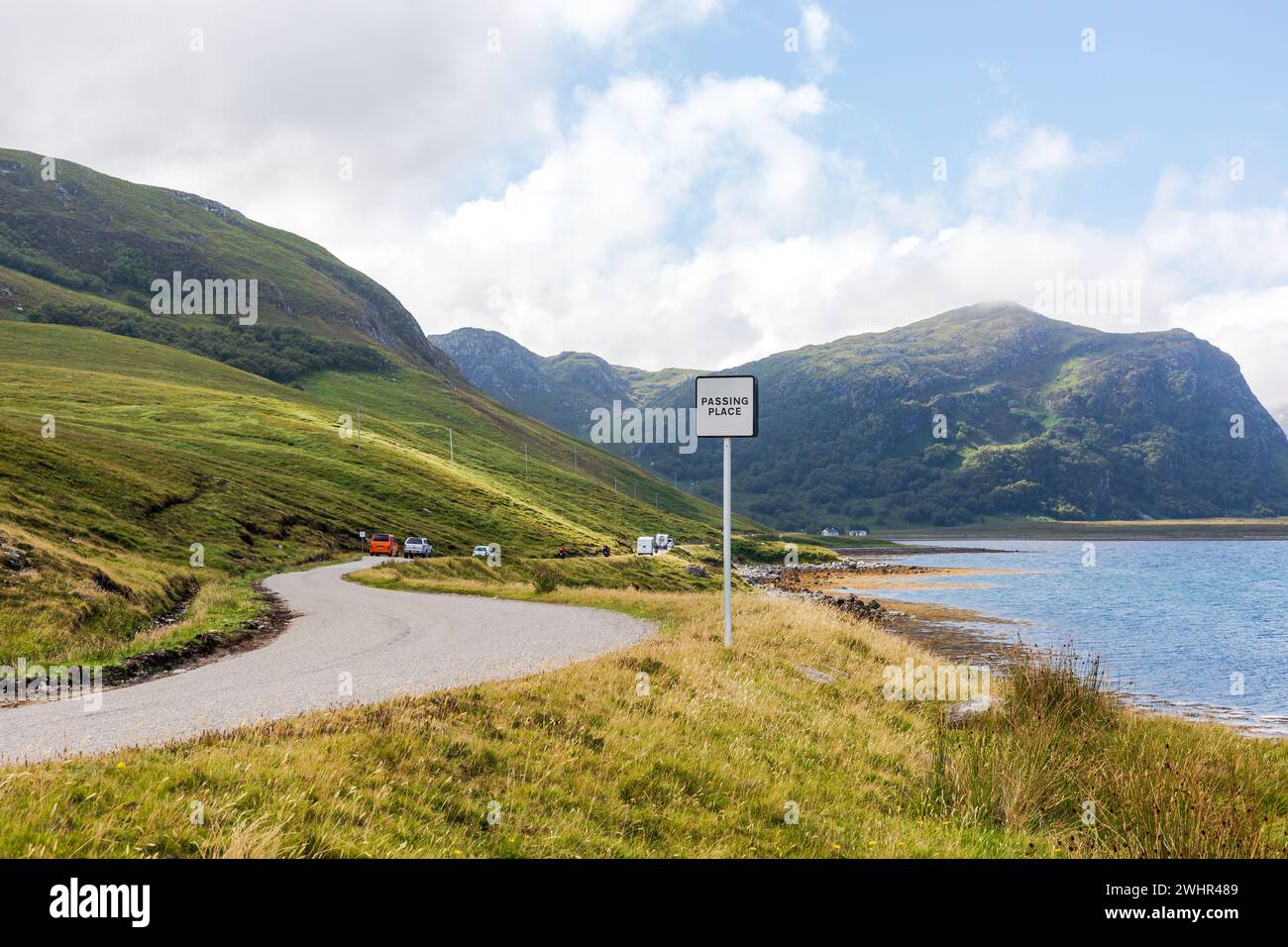 Slowdriving car on single wavy, serpentine road in NC500, Scotland