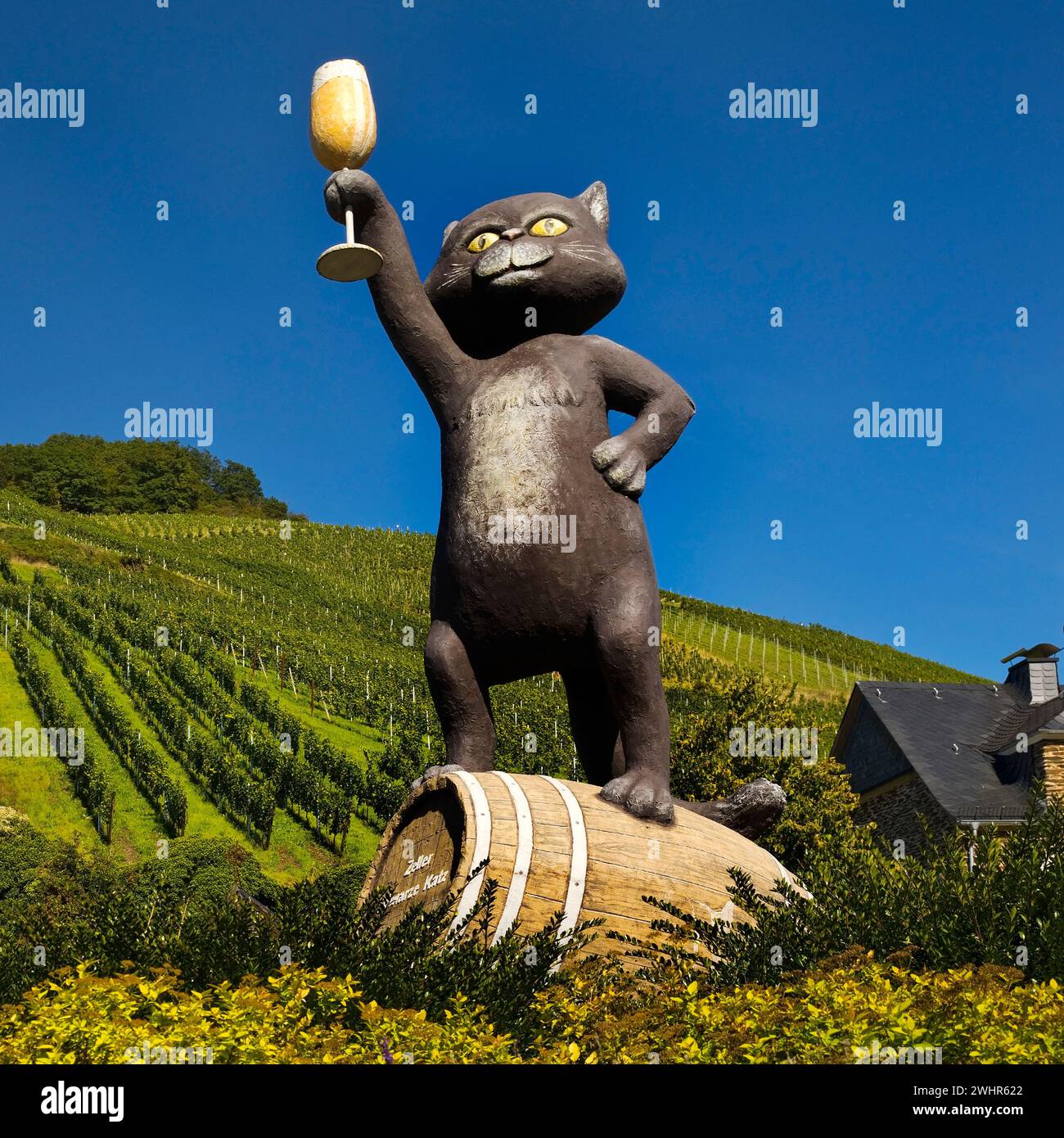 Black cat sculpture in front of wine-growing region, Zell Mosel, Rhineland-Palatinate, Germany Stock Photo